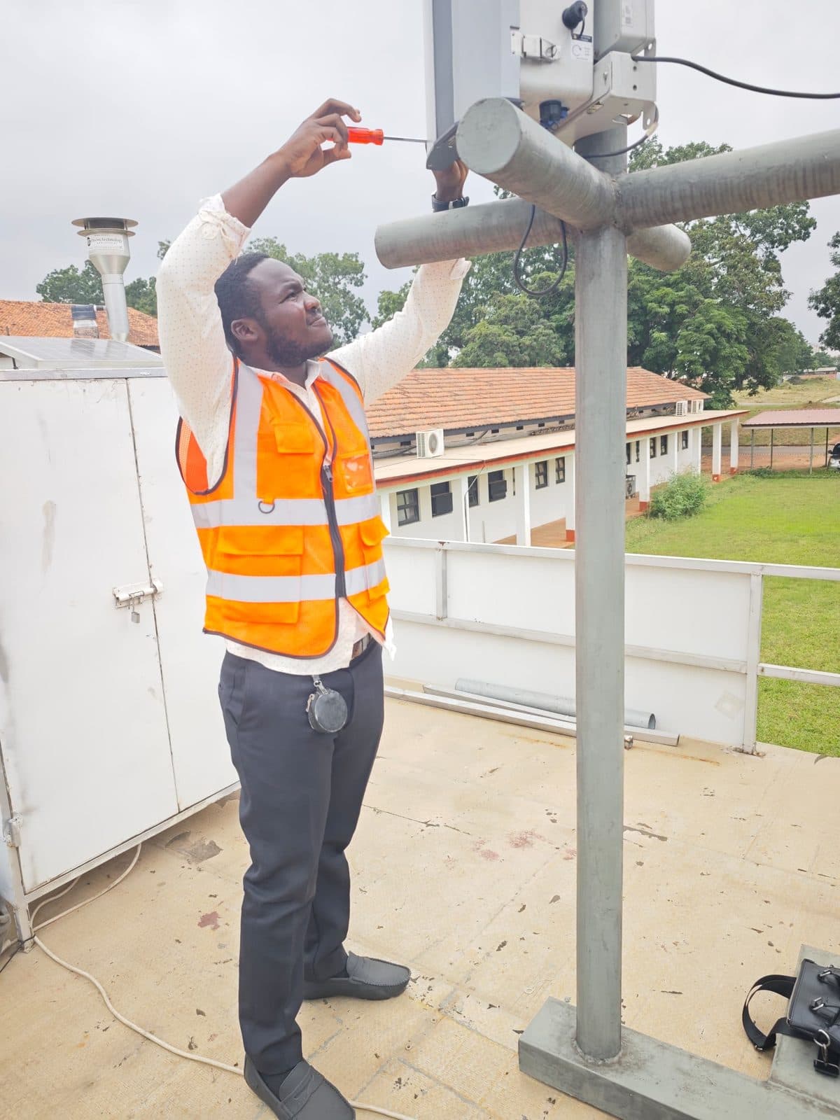 ECHT technician servicing an air-quality monitoring station on site